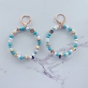 Super cute teal and gold beaded hoop earrings.